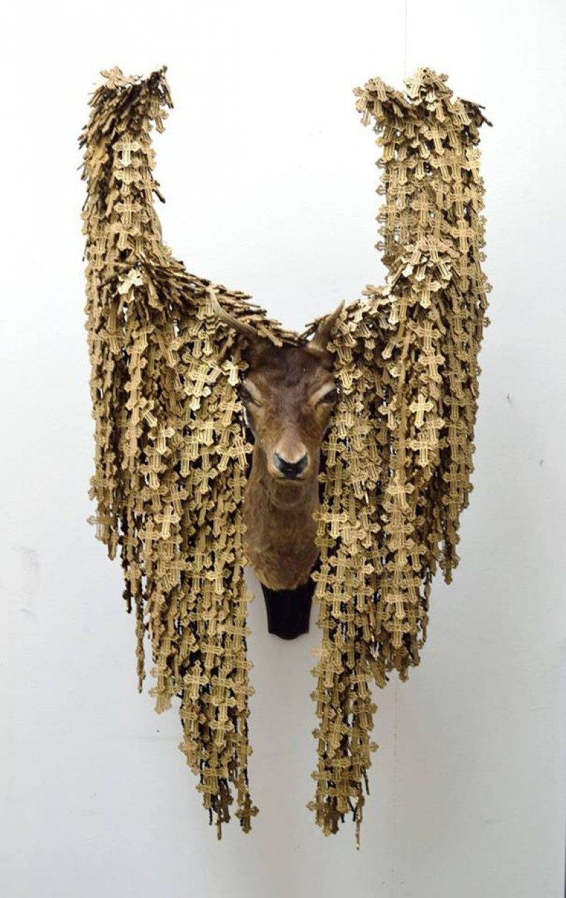 Rowan Corkill (London, England), The Seeker 2014-2016. Taxidermy Deer Head, Wooden Rosary Crosses, Black Beads, Rope, Fabric, Metal. Commissioned Artwork by Riviera, Ottawa, Canada. SOLD.