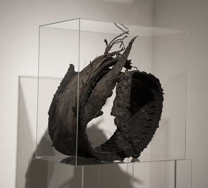 Joyce Westrop (Ottawa, Canada), Remnants of an Age, 2008, Tire remnant, plexiglas and wire, 24 x 24.25 x 13.5 inches. (Front View). $2200.