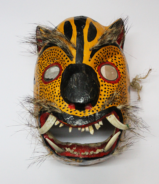 Danza o Festividad: Tecuan, Personaje: Tecuan, Comunidad: Chilapa, Estado: Guerrero, Madera tallada y policromada, 
espejo, pelo de puercoespín, dientes de animal, Circa 1970, 34  x 21 inches   