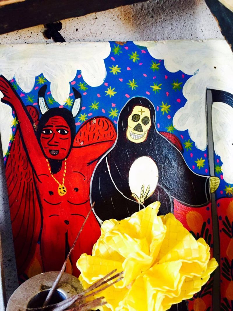 Vintage painting depicting Death & The Devil, unknown artist. 'All Saints' Shrine Installation by LPM Projects along with local participants. Commissioned for the Day of the Dead Celebrations in Puerto Vallarta, Mexico. 