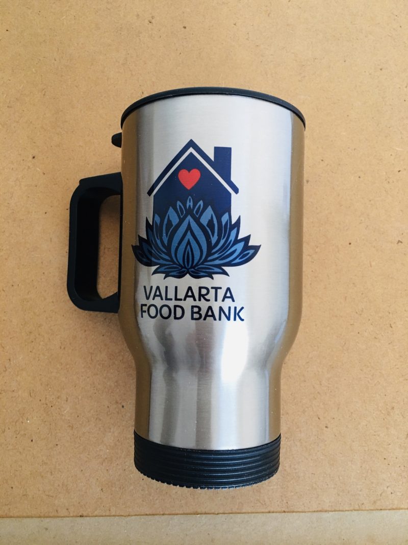Brand New 'Vallarta Food Bank' stainless steel coffee cup thermos with sealed lid. Measures 6 inches height x 4.5 inches width (includes handle). A dozen or so in stock. 100% of proceeds used to maintain daily costs of running the soup kitchen. $150 pesos each. 