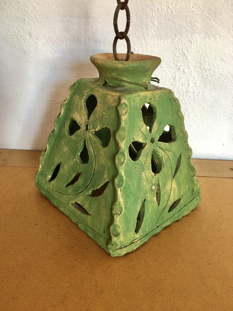 Terra Cotta Lampshade, Handmade, Wonderful detail & style, with a olive green patina. Measures 8 inches height x 7 inches  width at bottom x 3.5 inches width at top. Asking $150 pesos.
