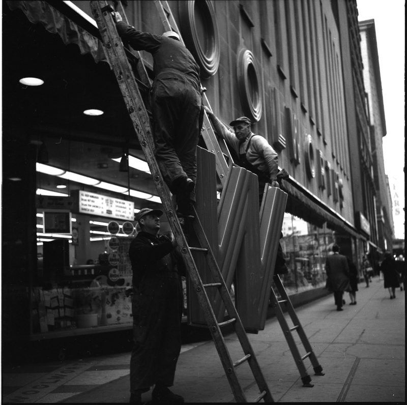 Vivian Maier, Chicago. Workmen with Woolworths Sign. 1968.