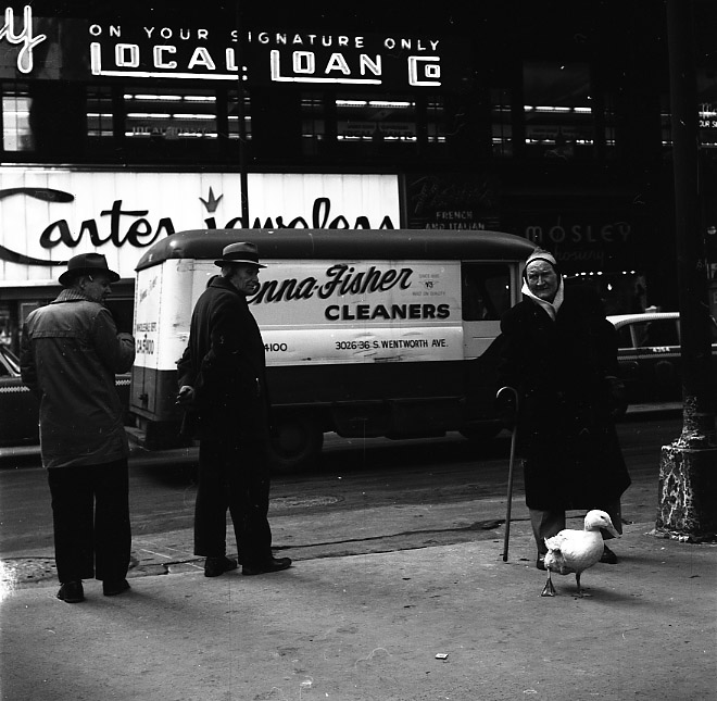 Vivian Maier, Chicago, Men with Duck. Circa 1965.