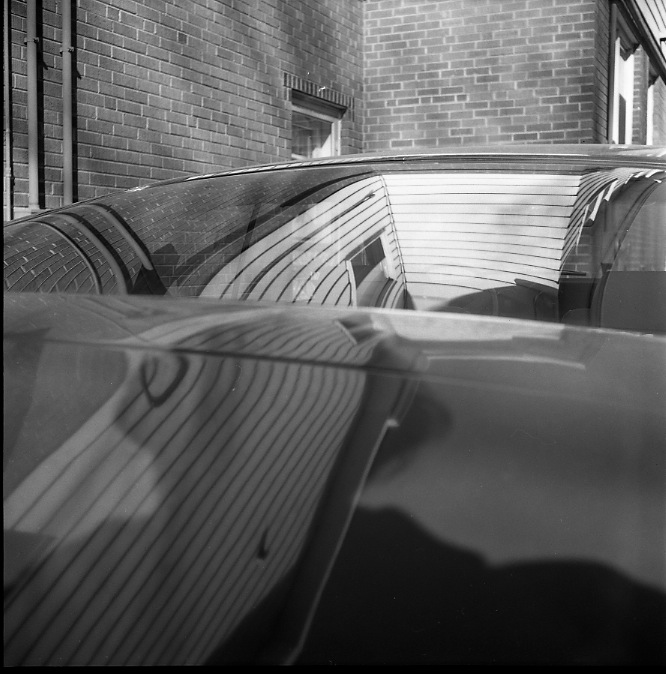 Vivian Maier, Wilmette, IL. Self Portrait, Shadow on Car. 1968.