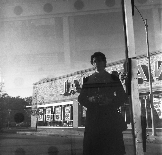 Vivian Maier, Wilmette, IL. Self-Portrait, Close-up, Reflection on Truck. 1972