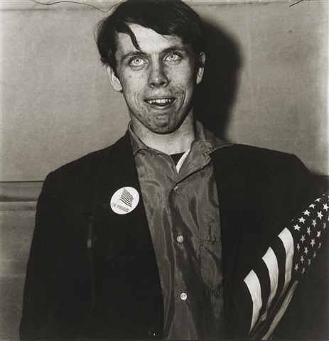 Diane Arbus (American, 1923–1971), 'Patriotic Young Man with Flag', NYC, 1967. Photograph, Gelatin silver print. Edition of 75. Dimension: 14.5 x 14.5 in. (36.8 x 36.8 cm.). Provenance: Bonni Benrubi Gallery, New York, USA
Private Collection: Signed, titled, dated, numbered ‘50/75’ by Doon Arbus in ink on verso; Estate and copyright hand stamps on verso. Private Collection.