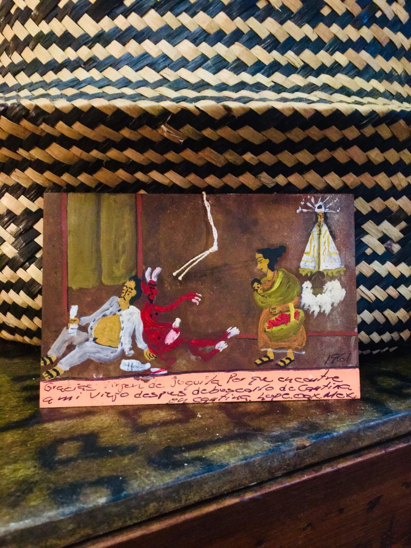 Original Religious Painting on metal / tin. Approx. 1960's Hand painted. Mexican Folk Art everyday life & chaos, with Religious Figures watching over them. Comes with small string at top for hanging on wall. Spanish message handwritten at bottom. Measures 4 x 6 inches. SOLD.