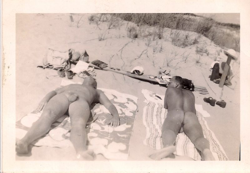 Lincoln Kirstein sunbathing nude (right) with friend, Fire Island, 1941 (date handwritten on verso), Measures 3.5 x 2.5 inches. SOLD.