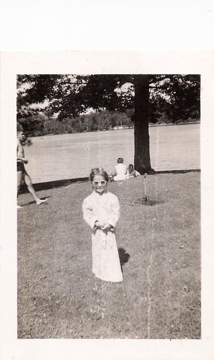 Mid Century Vintage Authentic Photograph, 'Child with Big Sunglasses & Bathrobe by the Lake', Handwritten on verso: 'Michael, Angela says guess who is behind the glasses - cute isn't she - taken at Lake George July 1944, Aimée'. Measures 2.5 x 3.5 inches, from an American estate sale. $30.