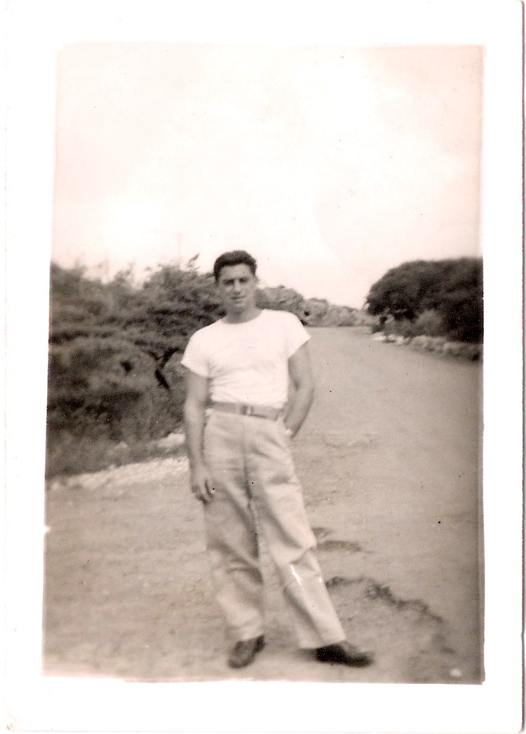 Mid Century Vintage Authentic Photograph, 'Young Man Posing Casually', Stamped in ink on verso: 'Passed by Army Examiner. Base 1266'. Dated in pencil 1942. From an American Estate Sale. SOLD