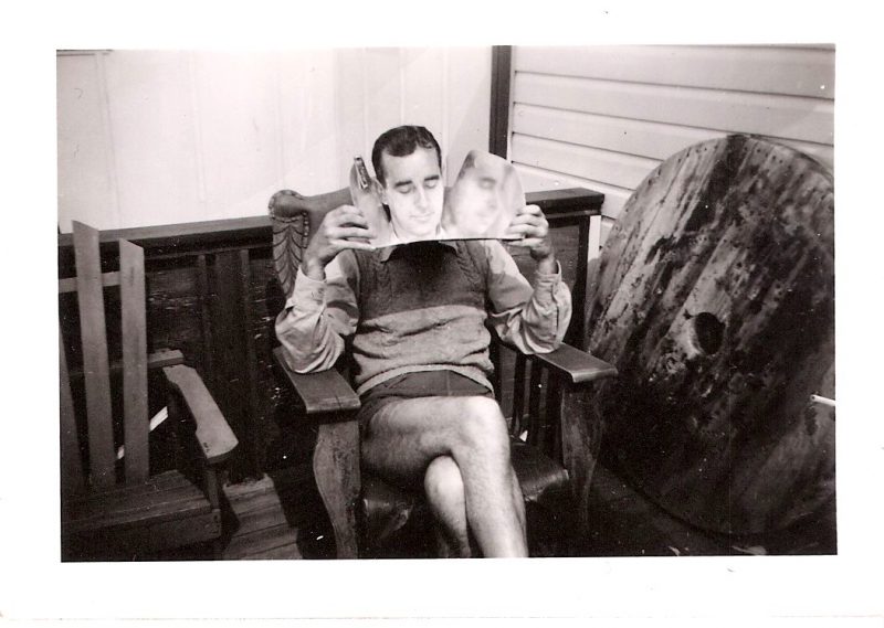 'Fire Island Series', Mid Century Authentic Photograph, 'Man with Tanning Reflector', Dated June 1949, Measures 2.5 x 3.5 inches. SOLD.