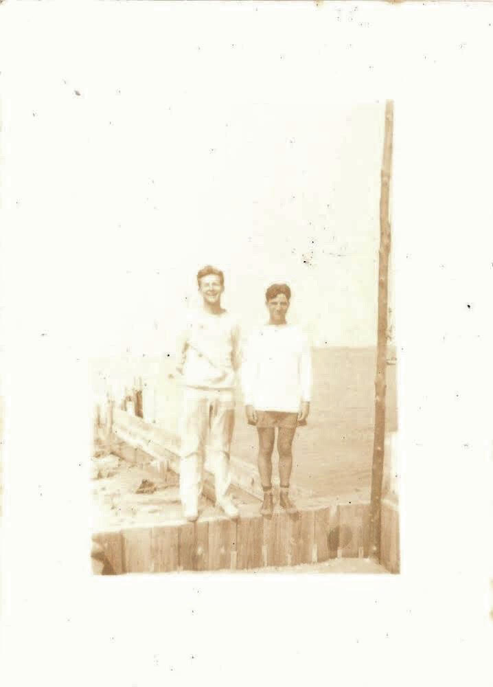 'Fire Island Series', Mid Century Authentic Sepia Photograph, 'Buddies Posing on Cherry Grove Dock', Measures 2.5 x 3.5 inches. SOLD.