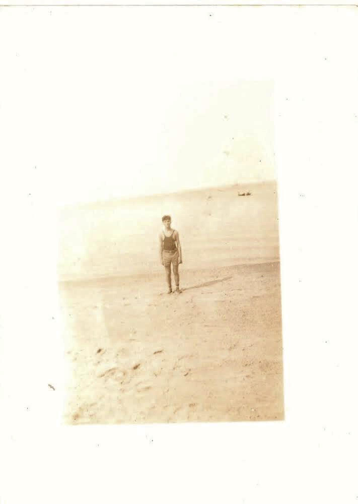 'Fire Island Series', Mid Century Authentic Sepia Photograph, 'Man Posing with Boat', Measures 2.5 x 3.5 inches. SOLD.