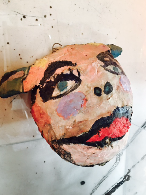 Outsider Art Papier Maché Head. Artist: Anne Johnson, Ottawa. Signed on verso in black marker. Silver ribbon meant for hanging from the wall, or as creepy Xmas ornament.$125.