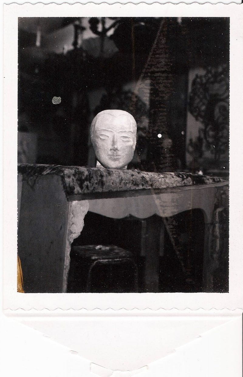 Mid Century Vintage Photograph / Polaroid. 'Sculpture of a Head in Artist Studio'. Measures 3.25 x 5 inches (with Polaroid flap attached). $30