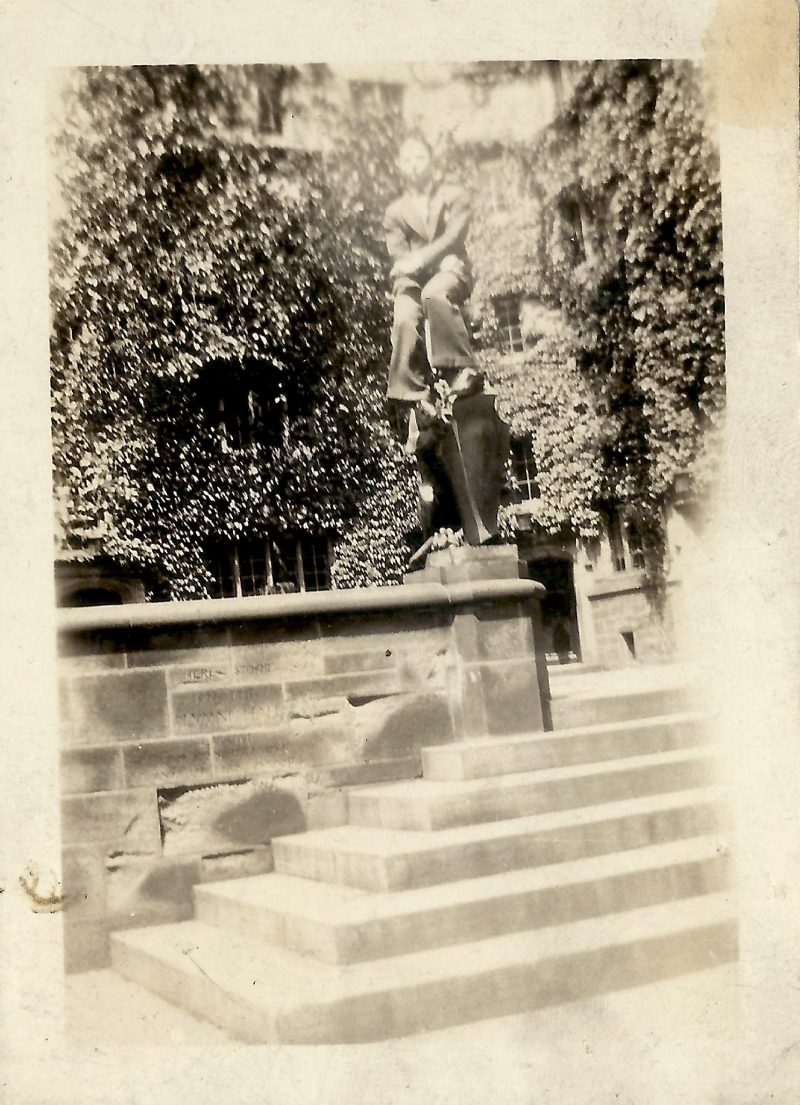 Vintage Mid Century Photograph, Man on Statue', Measures 2.5 x 3.5 inches. Written in pencil on verso '1928'. $15.