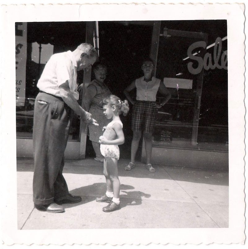 Mid Century Vintage Authentic Photograph, 'Hey Little Girl, Want Some Candy?'. Dated 1957 on verso. Measures 3.5 x 3.5 inches. $35.