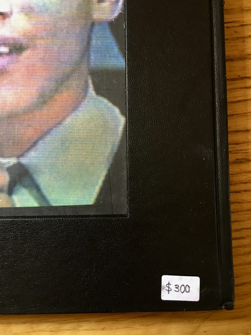 Photo of actual book for sale. Notice original price tag.
