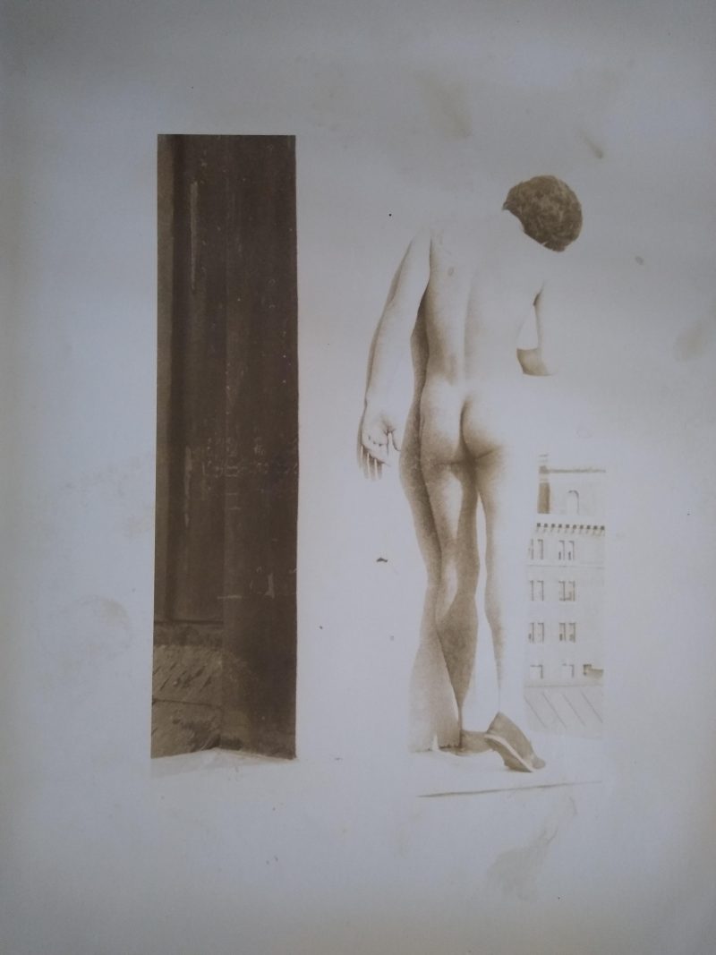 4. Untitled (from the Pier photographs series) Paper: 10 x 8 inches. Image: 6.5 x 4.5 inches. 1975-1986. An overexposed, sepia-toned print of a standing nude Hispanic male.