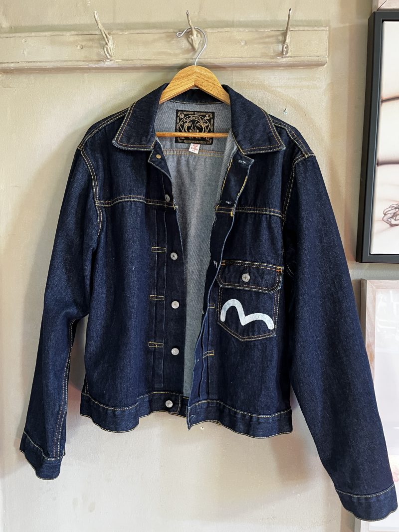 EVISU Jean Jacket. Unisex Hand Painted. Label: 'Crafted with Pride in EVISU XXL'. One outer pocket / no inner pocket. Button fastening, 4 pockets. 100% Cotton. EVISU Premium Quality Kamon tag. Mint condition. $300.