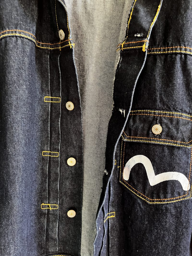 EVISU Jean Jacket. Unisex Hand Painted. Label: 'Crafted with Pride in EVISU XXL'. One outer pocket / no inner pocket. Button fastening, 4 pockets. 100% Cotton. EVISU Premium Quality Kamon tag. Mint condition. $300.