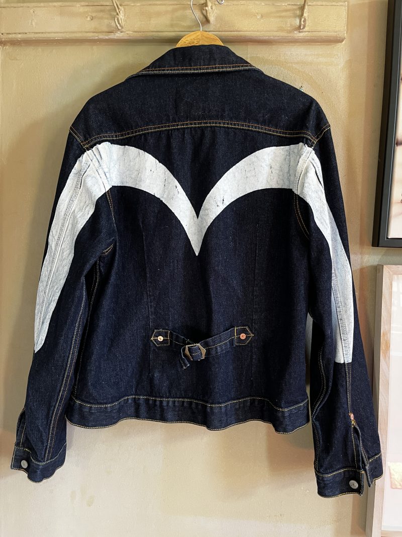 EVISU Jean Jacket. Unisex Hand Painted. Label: 'Crafted with Pride in EVISU XXL'. One outer pocket / no inner pocket. Button fastening, 4 pockets. 100% Cotton. EVISU Premium Quality Kamon tag. Mint condition. $300.
