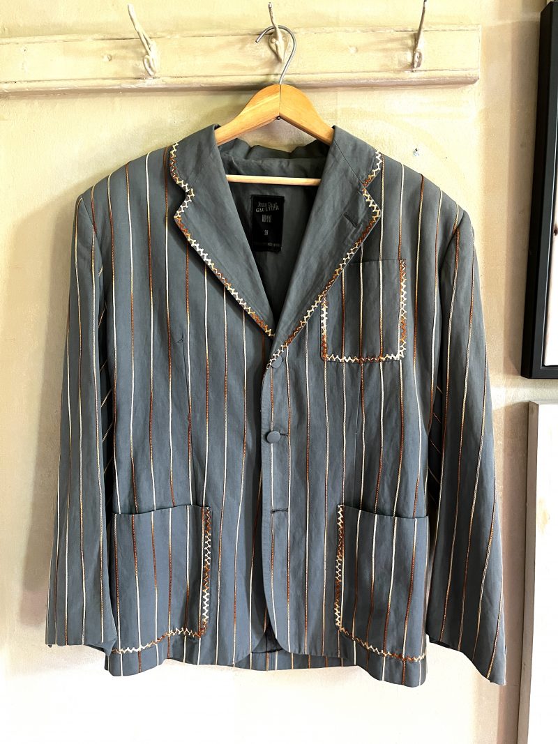 JEAN-PAUL GAULTIER, Homme, Size 50. Made in Italy. Embroidered Jacket, Light Olive Green. Detailed Stitching. Covered Buttons. Stripped Lining for 1 inner pocket & inner sleeves. 3 outer pockets. $400.