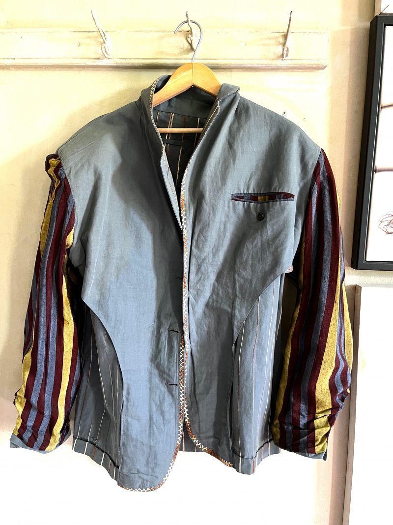 JEAN-PAUL GAULTIER, Homme, Size 50. Made in Italy. Embroidered Jacket, Light Olive Green. Detailed Stitching. Covered Buttons. Stripped Lining for 1 inner pocket & inner sleeves. 3 outer pockets. $400.