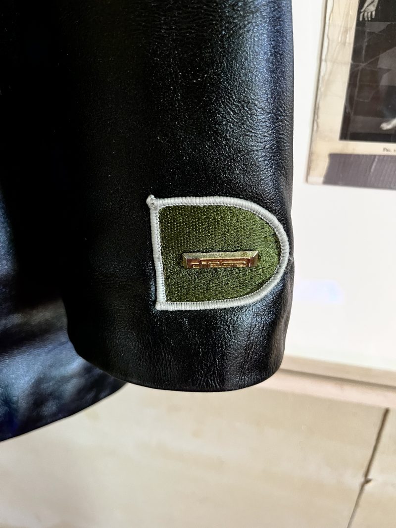 DDIESEL, 'Men's X/Large, Real Leather Coat / Technique Cosmique', Heavy Winter Coat, Silver Quilted Lining. Can be done up either to the left or to the right as there are loops on either side. One inner pocket. Two outer pockets. New York, 1990's. $600