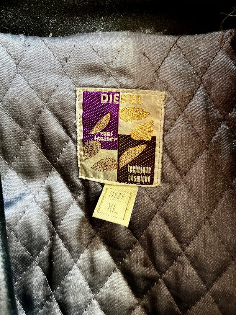 DIESEL, 'Men's X/Large, Real Leather Coat / Technique Cosmique', Heavy Winter Coat, Silver Quilted Lining. Can be done up either to the left or to the right as there are loops on either side. One inner pocket. Two outer pockets. New York, 1990's. $600
