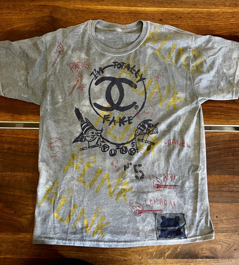 SCOOTER LAFORGE TSHIRT #3, 'FAKE CHANEL', Large Men (Unisex), Hand Painted & Printed & Dyed Cotton Grey T-shirt with Custom Hand-Stitched Label with 'Bear & Hearts': Classic trademarks  from the earlier years. Notice 'Paris is Burning' reference. USD$200. 