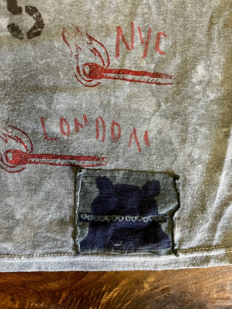 SCOOTER LAFORGE TSHIRT #3, 'FAKE CHANEL', Large Men (Unisex), Hand Painted & Printed & Dyed Cotton Grey T-shirt with Custom Hand-Stitched Label with 'Bear & Hearts': Classic trademarks  from the earlier years. Notice 'Paris is Burning' reference. USD$200. 